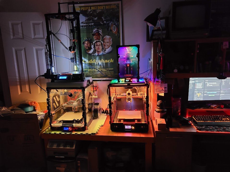 Timmit99's tweet photo. Family photo!
My 4 printers, that SOMEHOW are all functional at one time!
@Voron_Design 2.2, 2.4R2 and V0.2R1 alongside my @anycubic3dprint Kossel Linear.
What should my next project be?
Repairing my K40? Rebuilding my #MillRight M3 machine with Gecko drives and an enclosure? https://t.co/LIlvvihc41