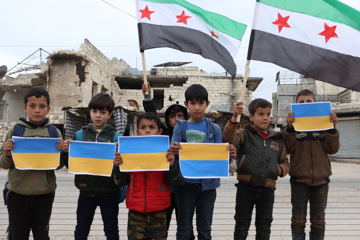 nedalalamari's tweet photo. When Syrian children stand in solidarity with Ukraine, these children endure Russian airstrikes on their homes every day. 
We grew up with a hatred for Russia.

Russia is a terrorist state
#freesyria #SlavaUkraine https://t.co/7pdOgCCDEK