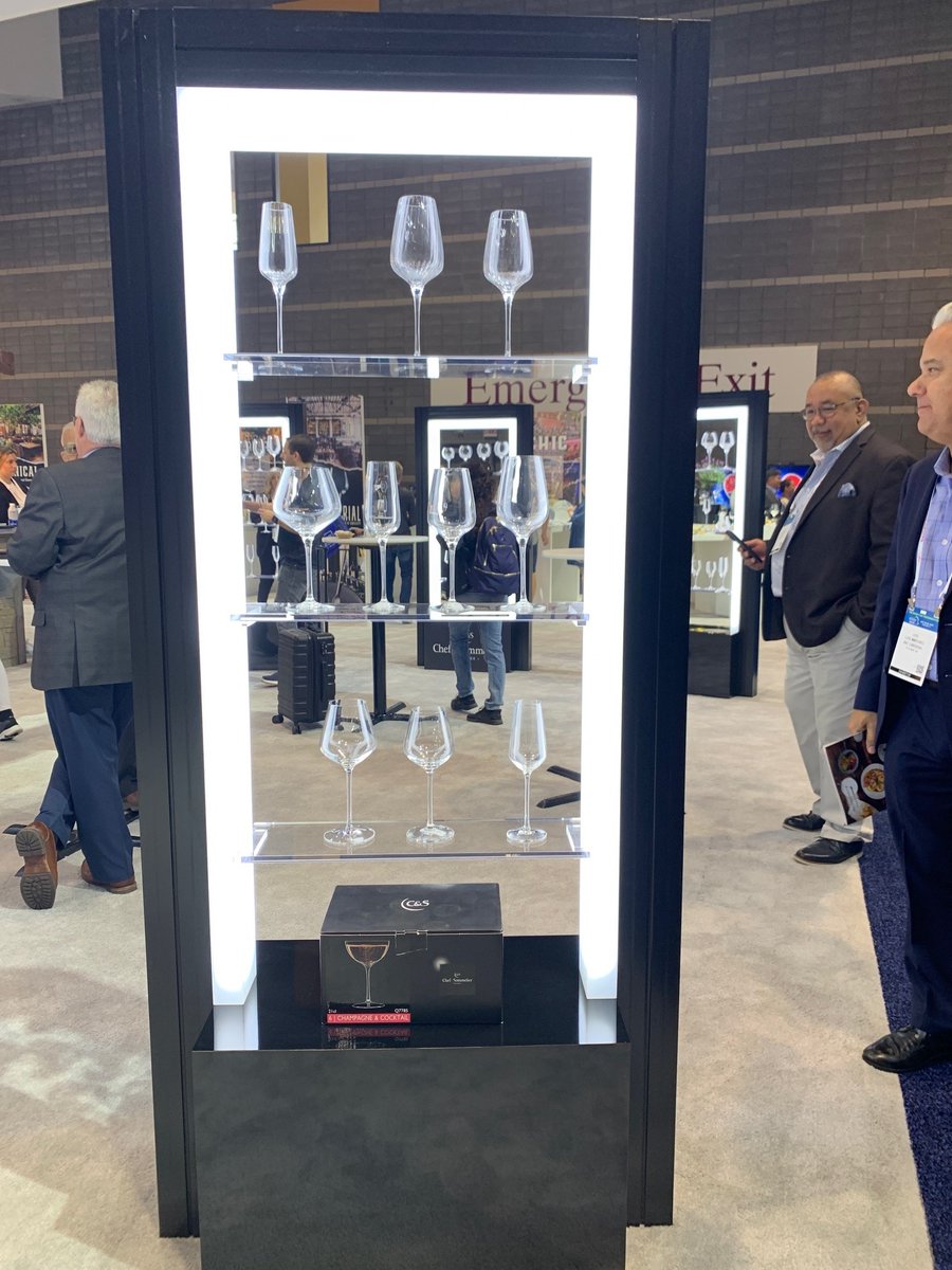 LakeshoreEx's tweet photo. Booth Solution of the Week - Arc Cardinal Rental Glassware Displays:  6 black metal-framed kiosks with clear shelves and perimeter bands of diffused edge lighting, creating a sparkle and drawing traffic. Tight time frame, gorgeous result! 
#ExperienceLakeshore #ArcCardinal https://t.co/ped3YeXGuE
