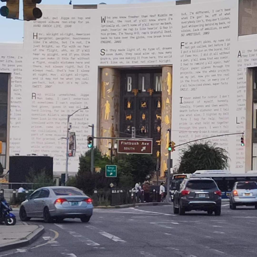 For_The_Masses's tweet photo. Jay Z's lyrics covers the Brooklyn library entrance wall. That's the library I went to as a kid and I still go to in the present. It's also the entrance where part of Special Ed's video for the song, 'I Got It Made' was created. #HipHop50 #JayZ #BrooklynLibrary https://t.co/pF71LeP6OU
