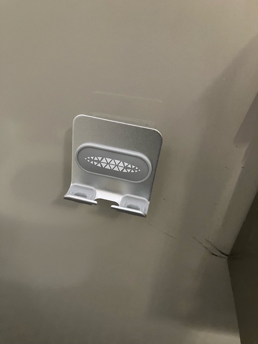 my office building installed cell phone holders in the bathroom stalls??