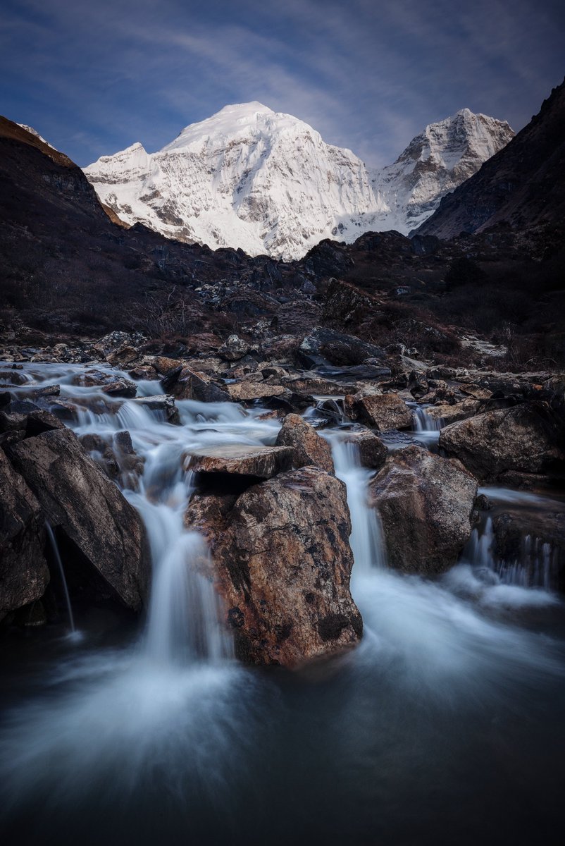 The freezing cold waters of the High Himalayas begin their long descent to the Indian Ocean in this scene recently captured in #Bhutan. Jomolhari, 2023.