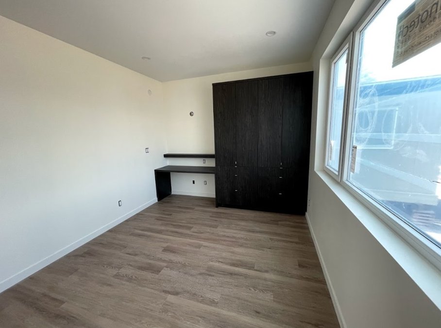 Luxury Vinyl Plank looking like a million bucks! It perfectly complements our beautifully crafted millwork: wardrobe and desk. #LuxuryVinylPlank #MillworkMasterpiece #ElegantDesign #FunctionalFurniture #HomeInspiration #LuxuryLiving #InteriorGoals #DreamHomeDecor #DesignEnvy