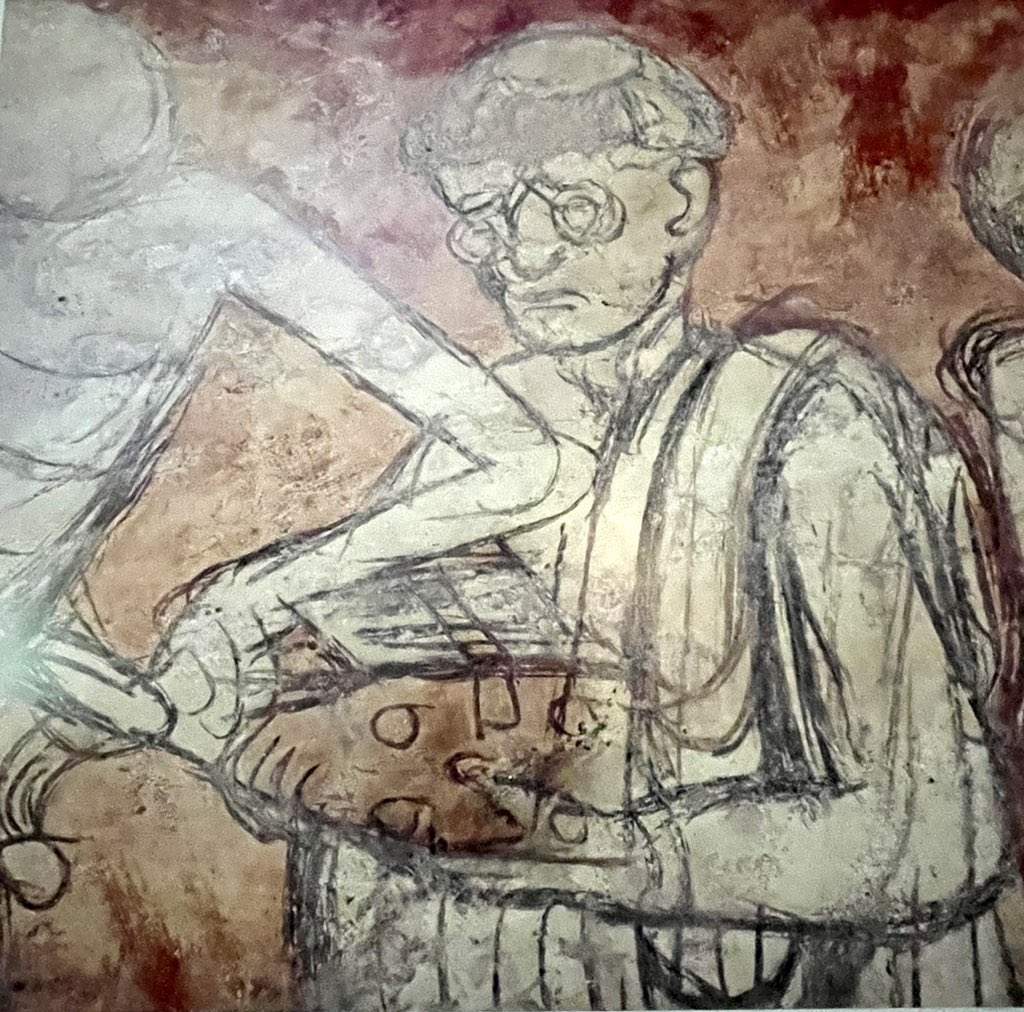 Sad looking specky theologian wrestling his book away from death - 15th C danse macabre <a href="/Abb_ChaiseDieu/">La Chaise-Dieu, rayonnante abbaye</a>