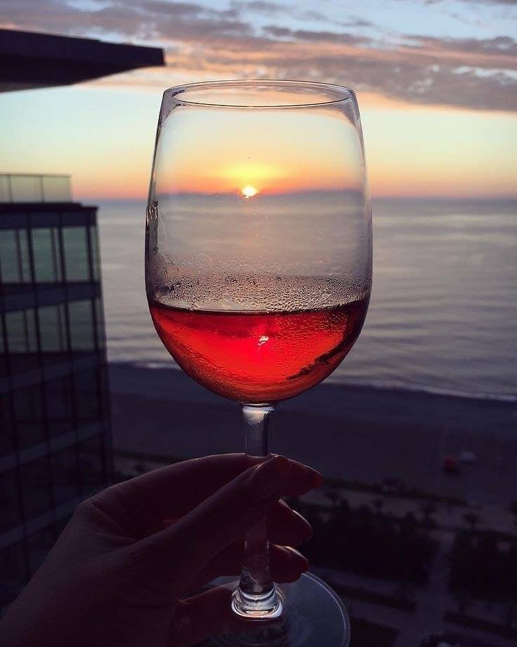 'Unwind with a glass of wine, as the setting sun kisses the sea . Let the serene beauty of the evening waves wash your worries away. #WineAndSea #EveningBliss #RelaxationGoals #wine #relaxation #ThirstyThursday #thursdayevening #wineoclock #winetime