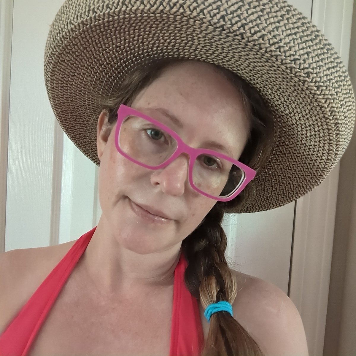 Today is a day of radical self-care as I remember my mom on the 8th anniversary of her death.

The pain hits differently this year, as I go through pregnancy without her.

This is me, in a bikini that barely fits, wearing her hat, before heading outside to read.