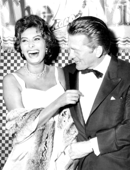 Sophia Loren having a good time with Kirk Douglas in 1958 at the premiere of 