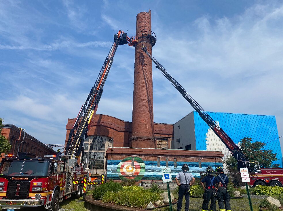 FraminghamFire's tweet photo. Today, we had a high angle rescue at 7 Bishop St. One 29 yr-old male construction worker was stuck ~100 ft in the air on a lift that got stuck on a railing being removed from the old Dennison smoke stack. Crews were eventually able to cut the bucket free after ~3 hrs on scene. https://t.co/KlAv3SM87u