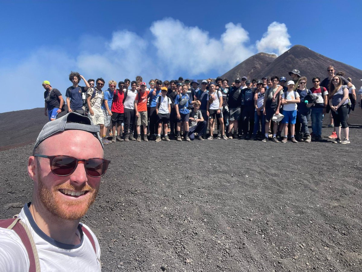 geotrinity's tweet photo. Mount Etna steaming in the background, Mr Munnery sweating in the foreground. We had a lavaly time...Ashtonishing! Fantastic to cool down in a waterpark in the afternoon. Day two was fabulous. #geogontour https://t.co/2kbVBZywMN