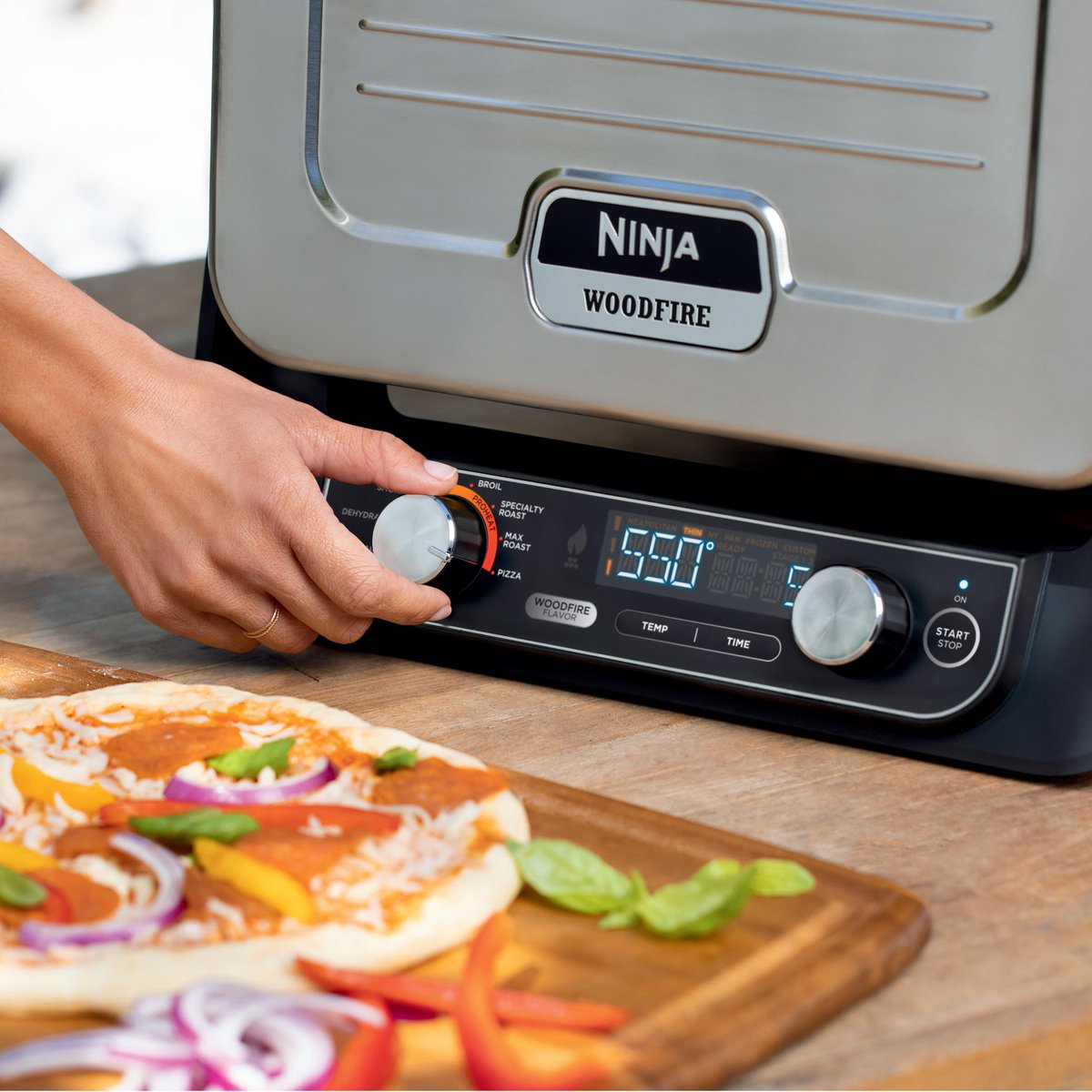 No yard? No problem. The Ninja Woodfire™ Outdoor Oven is guaranteed to make your city neighbors jealous. #NinjaWoodfire #NinjaOutdoorOven #NinjaKitchen