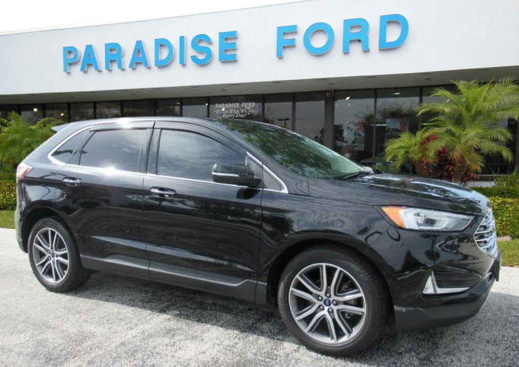 Our #UsedCarOfTheWeek is this 2019 Ford Edge Titanium Crossover. The vehicle includes a split folding rear seat, front fog lights, lane departure warning, and leather upholstery. Check it out at Paradise Ford! bit.ly/46QJlpp