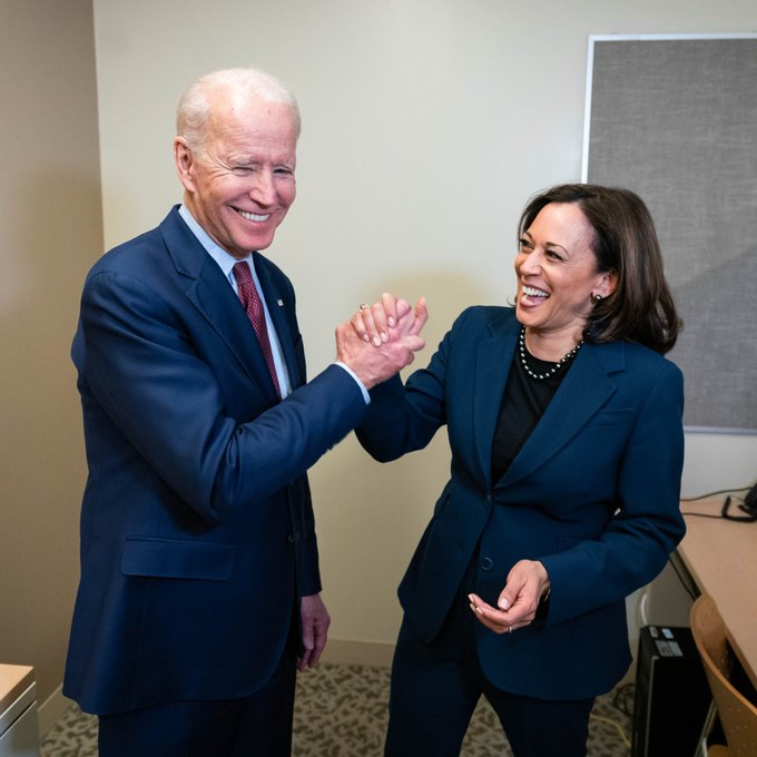 President Joe Biden and Vice President Kamala Harris high-fiving.
