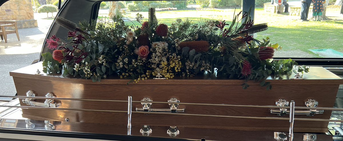 The hardest thing I have done, to give my darling husband Hugh a funeral that celebrated his life, his astonishing career. Friends and family came with love and I arranged the all-Australian flowers for his coffin. It almost broke me to tuck an English rose into the gum leaves
