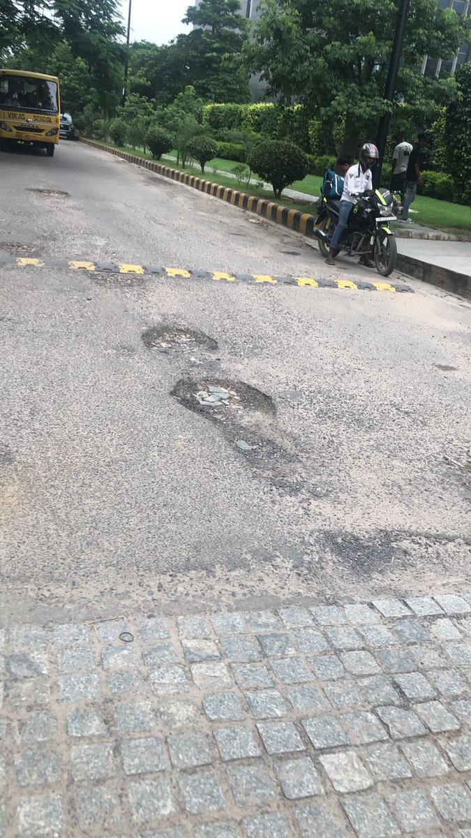 kusumsharmamona's tweet photo. Road patch work required urgently on La lagune road till the time road carpeting is not done. GMDA officials have already received the images and message. Kindly execute asap. I completely understand that due to rains road carpeting work isn’t happening. 
@OfficialGMDA https://t.co/hYRjHuaeZ8