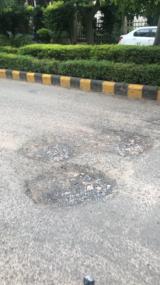 kusumsharmamona's tweet photo. Road patch work required urgently on La lagune road till the time road carpeting is not done. GMDA officials have already received the images and message. Kindly execute asap. I completely understand that due to rains road carpeting work isn’t happening. 
@OfficialGMDA https://t.co/hYRjHuaeZ8