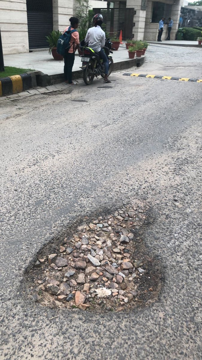 kusumsharmamona's tweet photo. Road patch work required urgently on La lagune road till the time road carpeting is not done. GMDA officials have already received the images and message. Kindly execute asap. I completely understand that due to rains road carpeting work isn’t happening. 
@OfficialGMDA https://t.co/hYRjHuaeZ8