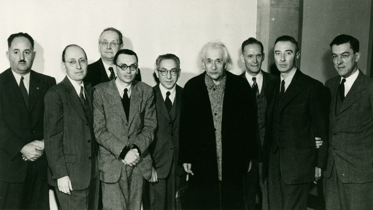 [L-R] 

H. P. Robertson, E. Wigner, H. Weyl, K. Goedel, I. I. Rabi, A. Einstein, R. Ladenburg, J. R. Oppenheimer, and G. M. Clemence.

Albert Einstein’s 70th birthday celebration at the Institute for Advanced Study, Princeton.