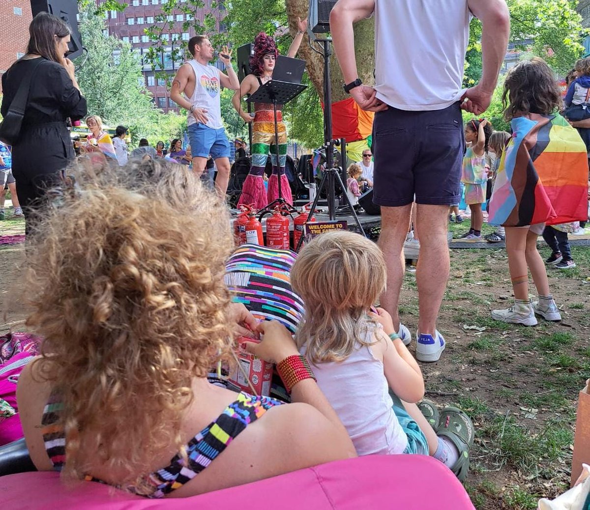 There've been thousands of tweets full of hate, cruelty &amp; attempts at ridicule directed at me this week. But it's #Pride weekend, queers are &amp; always will be queers, and you can't erase us. Here's me &amp; my kid having fun watching <a href="/AidaHDeeDrag/">Aida H Dee The Storytime Drag Queen</a> story time at #Pride yesterday.