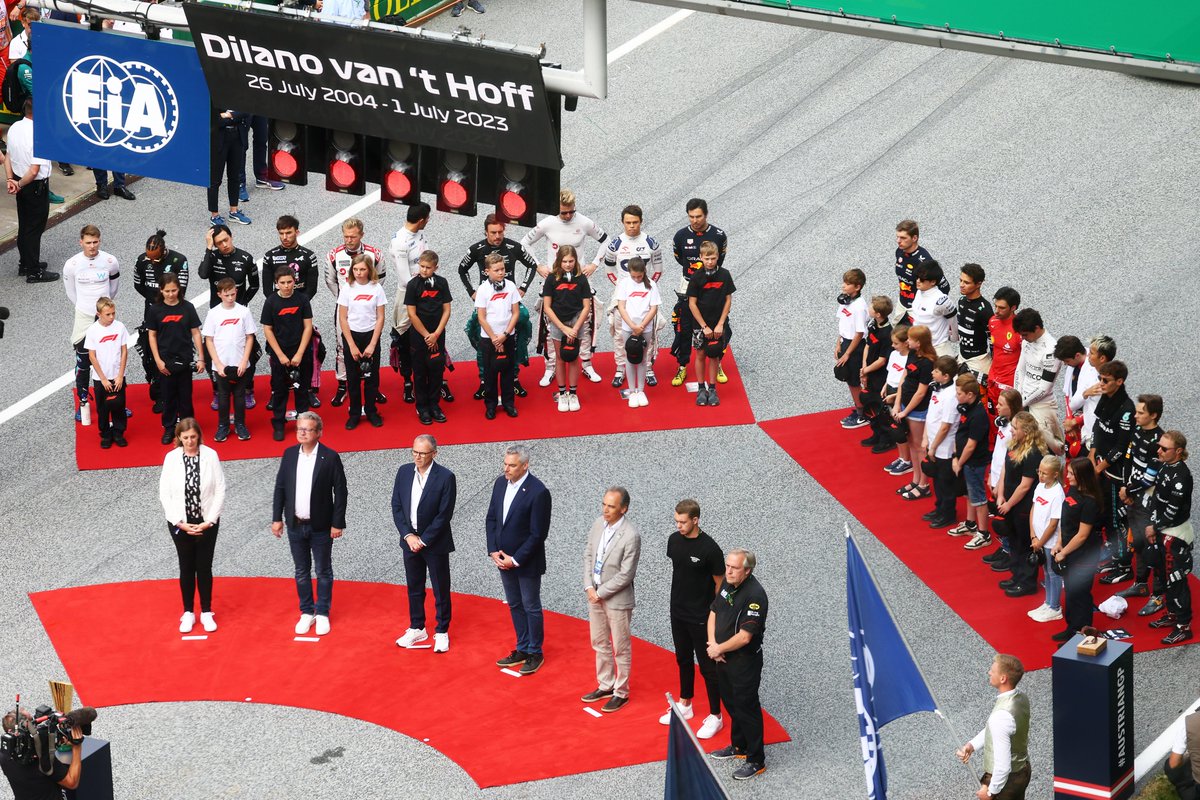 redbullracing's tweet photo. The F1 grid stands in silence in memory of Dilano van 't Hoff. #AustrianGP https://t.co/BX1teticWM