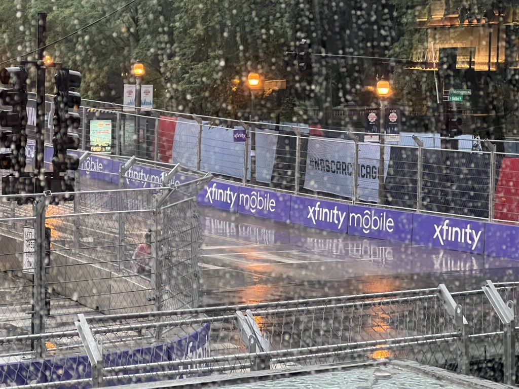 filming_chicago's tweet photo. To me it looks like there is at least some standing water on the track. @NASCARChicago they will run in rain but not in lightning and not with standing water on the track. https://t.co/JrlXd44ifn