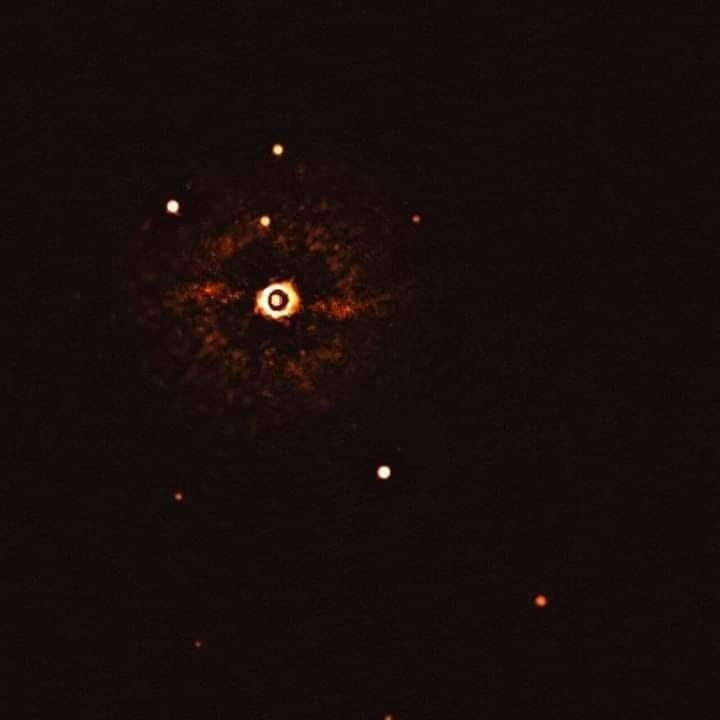You're looking at the first direct image of another planetary system located about 300 light-years away around a star like our Sun. Credits: ESO