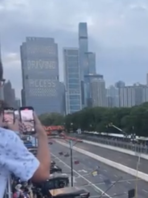 ciphree's tweet image. Does anyone know what this building in the background of the nascar chicago street race is about? It says Driving / Access in the windows