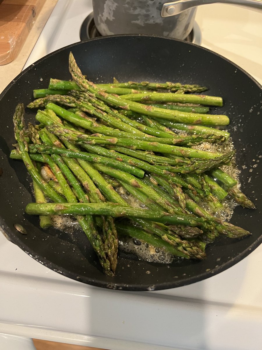 Asparagus in olive oil and butter, with fresh garlic. Yummy