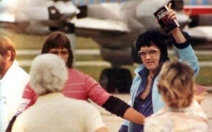 July 1, 1976: Elvis in Shreveport, Louisiana departing his airplane, the Lisa Marie with <a href="/LindaThompsonLT/">Linda Thompson</a> and his entourage.