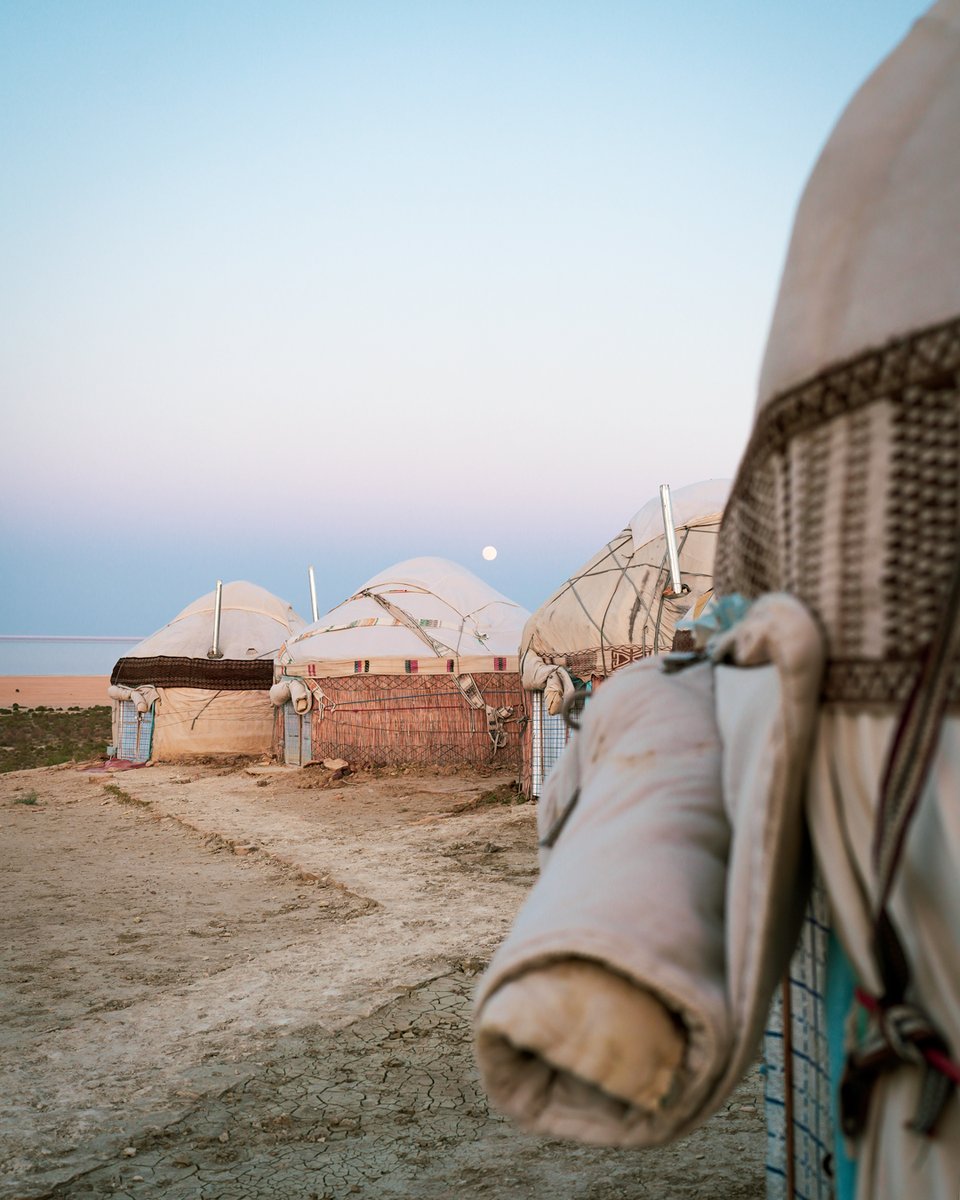 Sun setting and moon rising over the Aral Sea. My dream of sleeping in a yurt came true in Uzbekistan. 
#Uzbekistan #aralsea