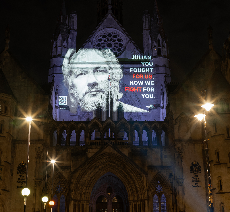 wikileaks's tweet photo. Projections around London call attention to the continued unjust detention of WikiLeaks publisher Julian Assange on the occasion of his 52nd Birthday today #FreeAssangeNOW #FreeAssangeNOW https://t.co/gX6ntnyvys