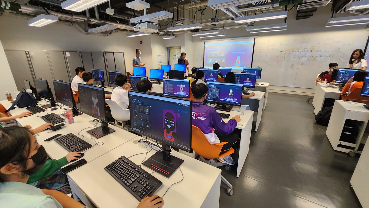 Pivotsch's tweet photo. We have joined forces with the Regional Crime Prevention Kowloon East Region, Prof Sky Lo from the School of Design at @HongKongPolyU, @erichwong from @TheSandboxGame to learn about #metaverse &amp; #cybersecurity, students also use @VoxEdit to create avatar. https://t.co/tVBJ4qMEmI