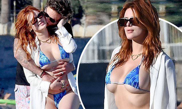 Bella Thorne risks wardrobe malfunction in VERY skimpy bikini as she packs on the PDA with Mark Emms https://t.co/58LC5l3e5n