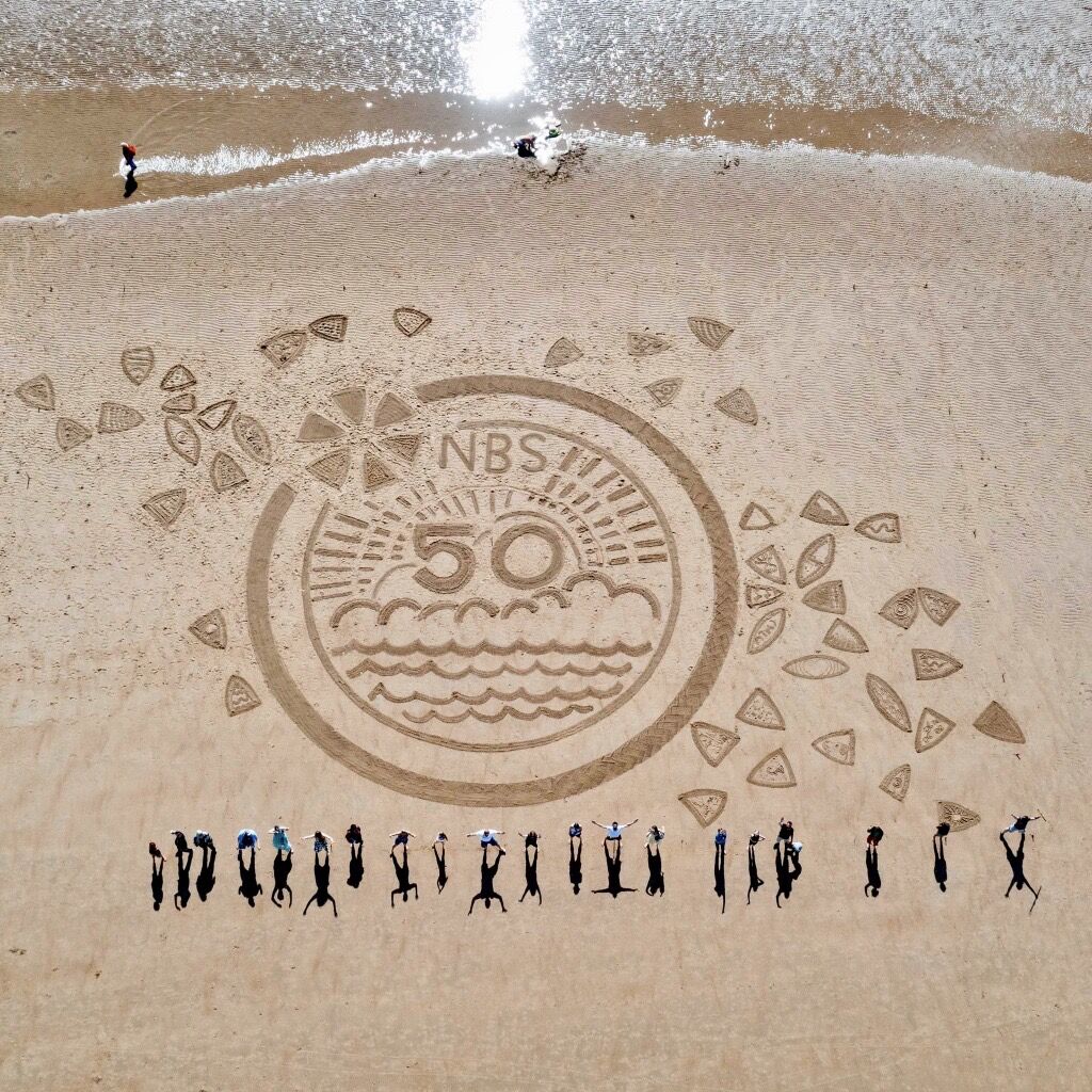 theNBS's tweet photo. Last week we took to Longsands Beach in Tynemouth for our first NBS Family Beach Day! 🏖️ 😎 

We worked with the incredible Soul2Sand to create an amazing sand art piece celebrating 50 years of NBS. Check out the final result 👇 

#NBS50 #LifeAtNBS https://t.co/rp7x0cfN7Z
