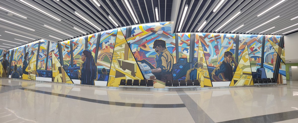 Airports offer serenity and beauty in visual arts when we takea moment to take it in.  Here at the rental car area <a href="/CVGairport/">CVG Airport</a> All Along the Control Tower evokes celebration of the people who ensure our travel safety.