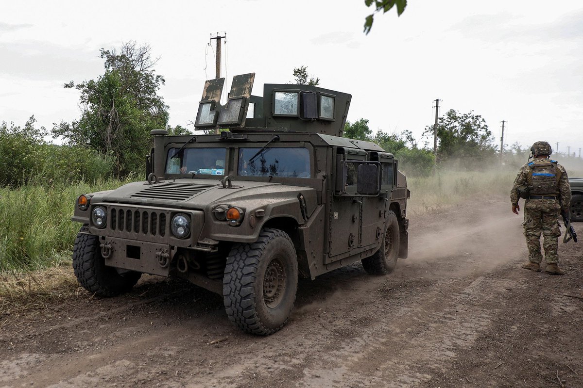 senguptacanada's tweet photo. #Russia-Ukraine War: A #Ukrainian military vehicle moves along a road near the recently #retaken village of #Novodarivka in #Zaporizhzhia region, #Ukraine, on July 2. https://t.co/FRCPgjOFjG