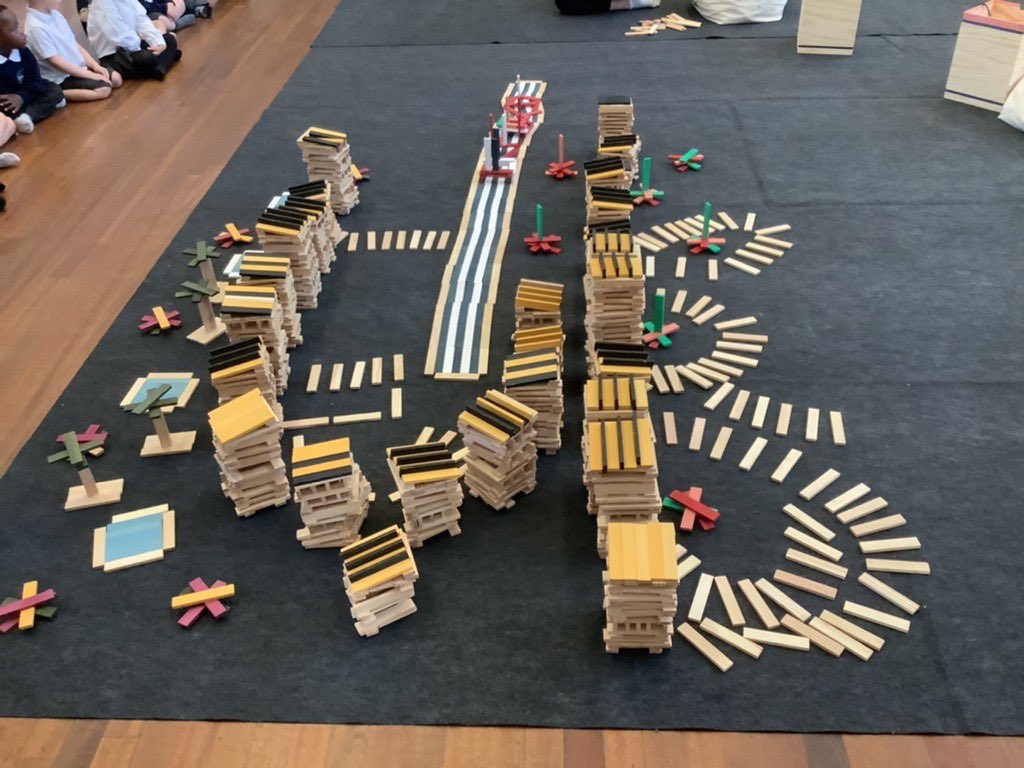Reception children had a great time with Kapla, building our own village complete with houses, river (and boats), trees, ponds and flowers! <a href="/KaplaclubsUK/">KAPLA Clubs</a>