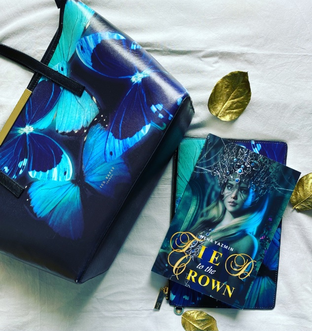 NehaYazmin's tweet image. #YAMonday
Aaryana entered the ballroom and everyone turned to stare. She knew what they saw: A tall woman in a shimmering green-blue gown and a fancy gold Crown embedded with blue and green gemstones. They couldn’t see her ‘tail’ yet, trailing after her like a loyal pet.