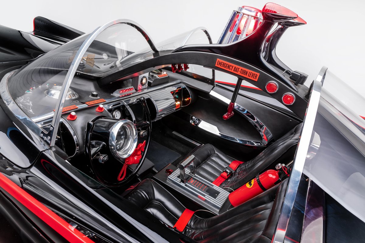 The original 1966 Batmobile from Lincoln's Futura concept car of 1955,  retained the shark-like contours and bubble top of the Futura, it was  painted gray with white stripes. However, after screening, it, image size:1200x800