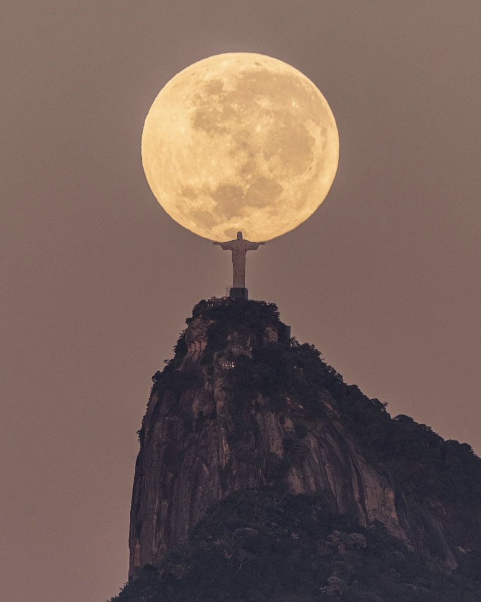 Unreal picture taken by Leonardo Sens of the Christ the Redeemer statue in Brazil seemingly holding the moon. After three years of observing celestial patterns, Sens figured out that the picture would perfectly line up on June 4, which when he took the shot.