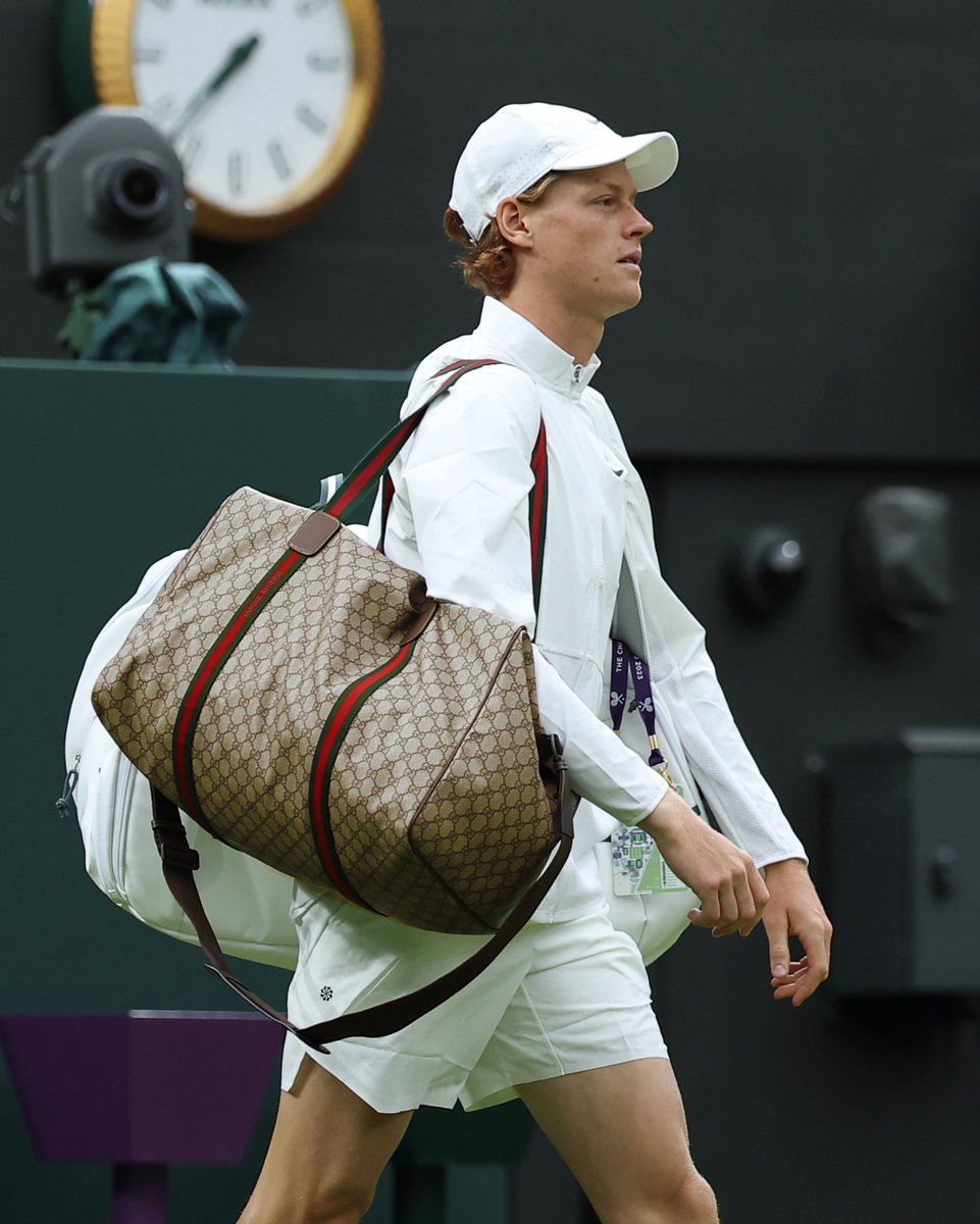 gucci's tweet photo. .@janniksin, Ambassador for the House, is captured on court at @Wimbledon where he won his first match with a one-of-a-kind #Gucci duffle bag custom designed for him. https://t.co/72sVjqGeYD