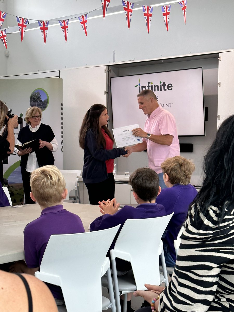 oaklandsprimary's tweet photo. 🤩🤩Immensely proud of Evie-Mai today! One of the 6 finalists of the Infinite “Clean energy” poster competition. A fabulous morning @RoyalMintUK even got to meet @IoloWilliams2 for the presentation! Diolch yn fawr! 🤩🤩 #EthicalElin #TEAMOaklands https://t.co/yYnqOSnCrg