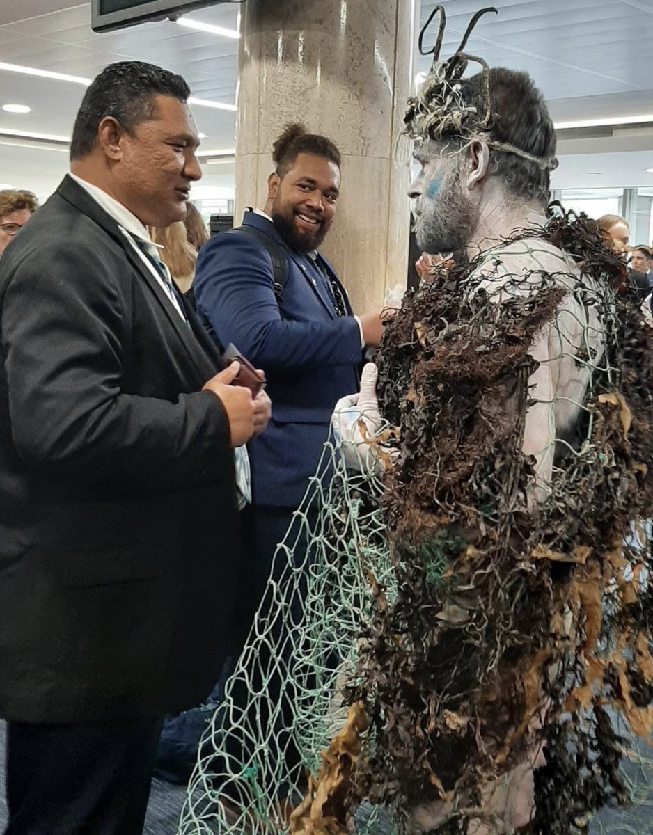 oceanrebellion's tweet photo. “Halve shipping pollution NOW!” shouts Poseidon! He’s at an @IMOHQ drinks reception for #MEPC80 delegates calling out obstructive member states like Russia, Argentina & Saudi. Just stop munching canapés & ACT NOW?! Shame on you #IMO!
#SortYourShipOut #ChangeShipping
#MEPC80 https://t.co/udrGFYn1b9
