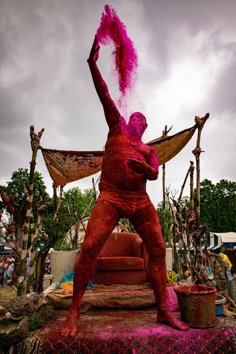An installation at the Down The Rabbit Hole festival this weekend, by
<a href="/NachoCarbonell9/">Nacho Carbonell</a>, featuring <a href="/DenvisDeadly/">dennis grotenhuis</a>, alias the king. You could hug him for three days on his throne in order to get a firm clay and coloured powder imprint of his impressive body in return. <a href="/DTRH_Fest/">Down The Rabbit Hole</a>