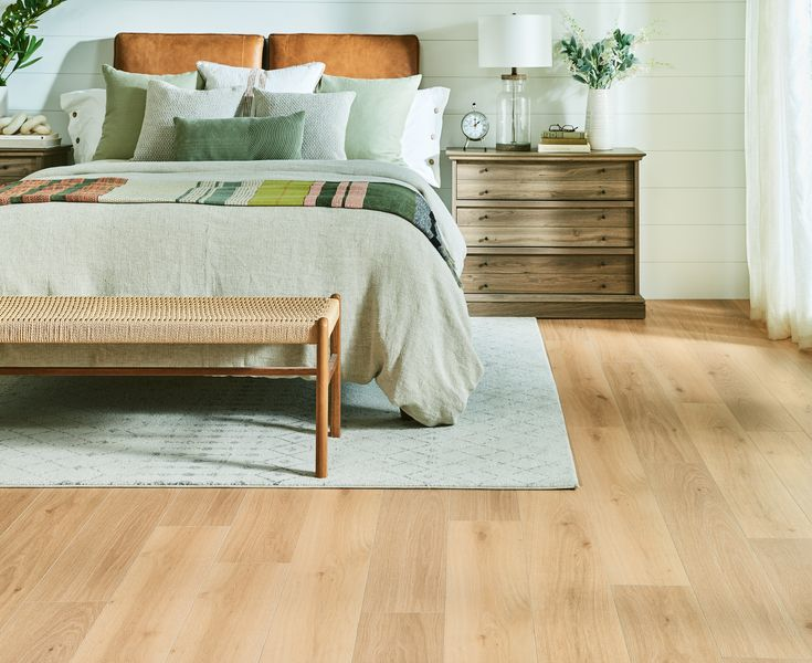 We're loving the fresh greenery, earth tone color palette and natural décor shown here in this relaxing bedroom and the flooring, @ManningtonFloors Restoration Collection® Laminate, helps bring it all to life. Flooring details: Haven, Color: Wheat. pbxx.it/cPcUMq