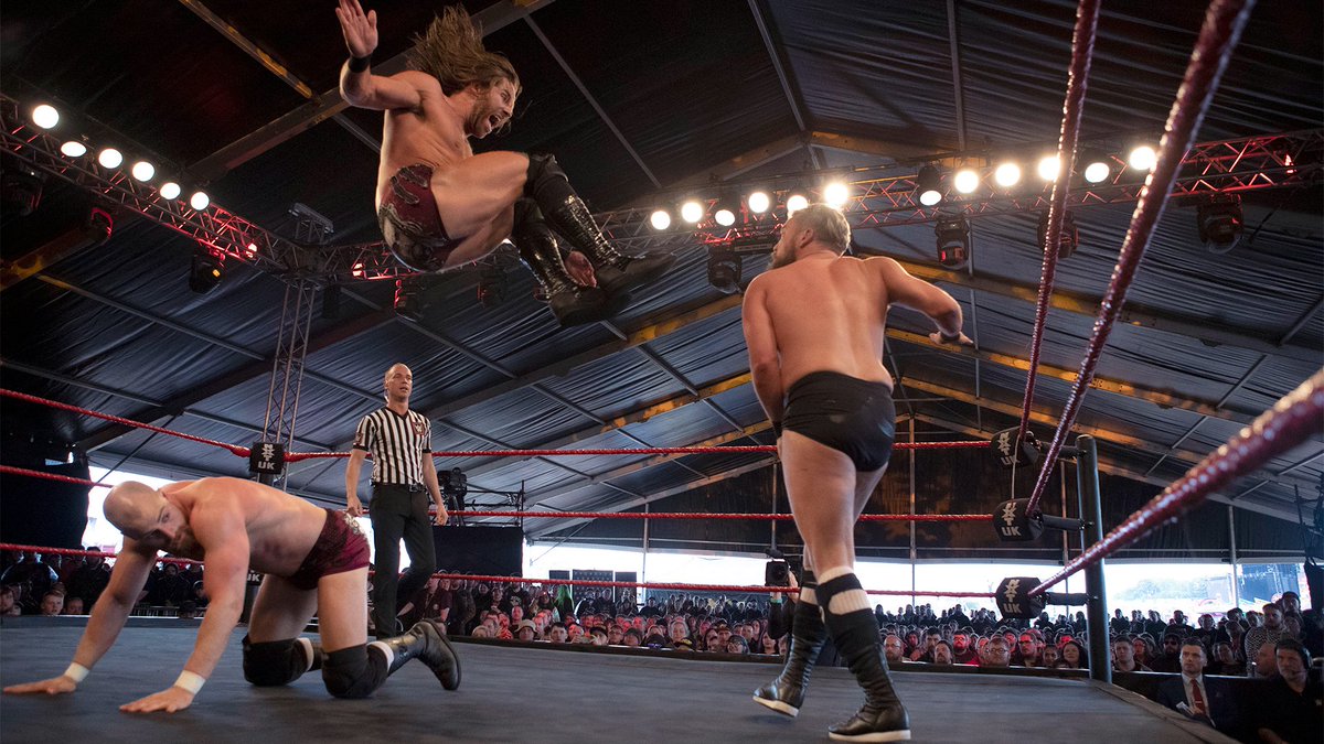 NXTUK_Legacy's tweet photo. July 3, 2019:
At Donington Park as part of Download Festival, the #NXTUK Tag Team Championship rematch between #GrizzledYoungVeterans and #MustacheMountain was thrown out when #IMPERIUM hit the ring.
W/@trentseven handcuffed, @Gunther_AUT attacked #TylerBate.
๐ธ WWE
#DF2019 https://t.co/dhRFDLynhc
