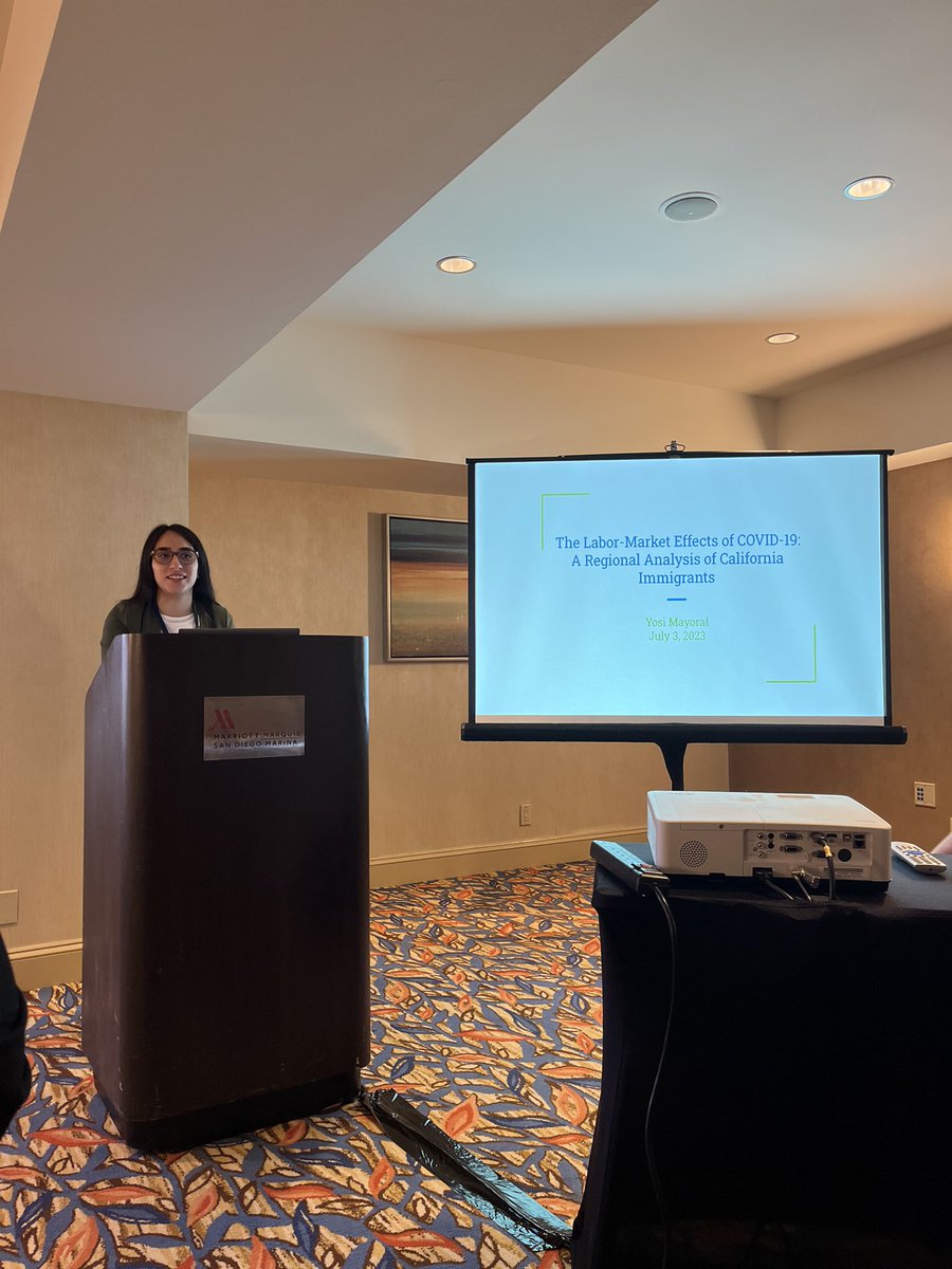 Yosi Mayoral ‘23 (PPA-Econ) presenting her research on the COVID pandemic and immigrant households at the Western Economic Meetings <a href="/weai_org/">Western Economic Association International</a>