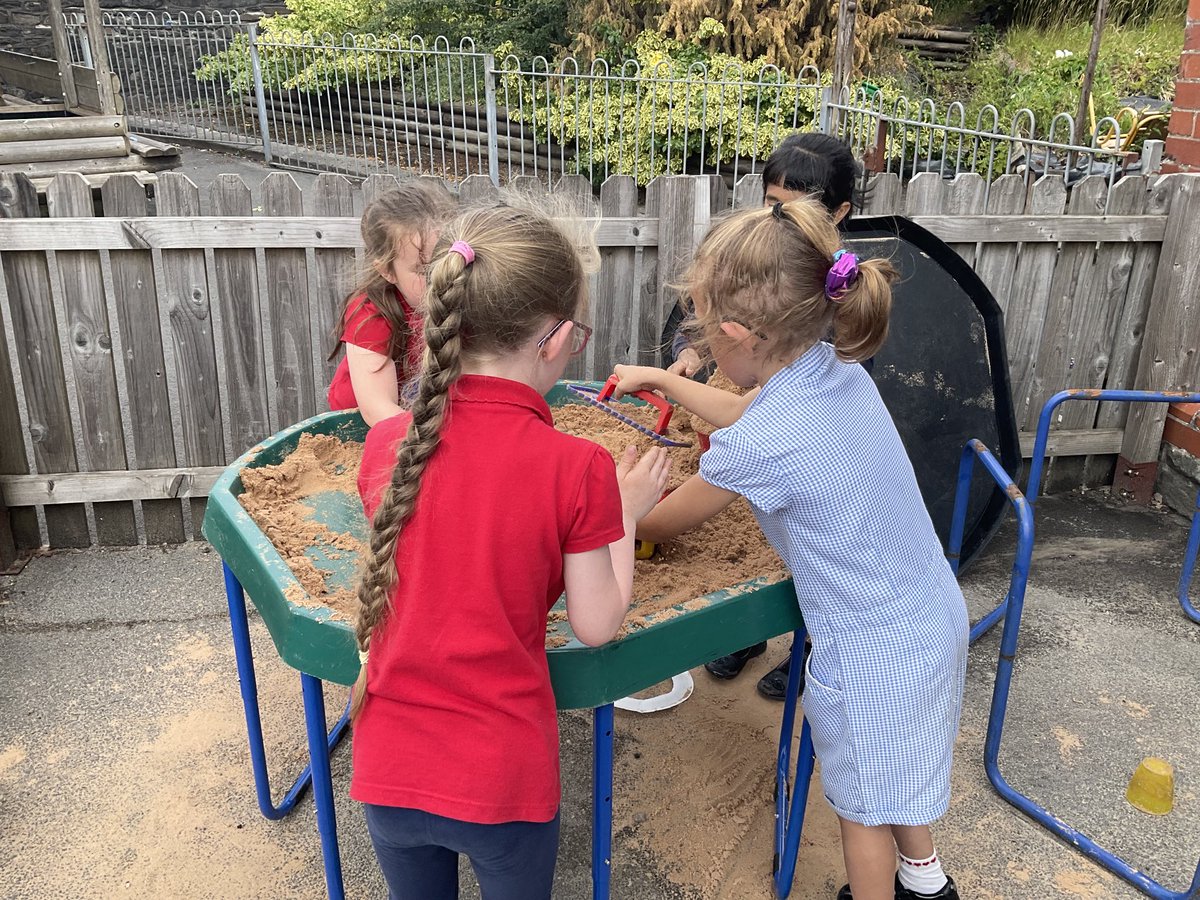 We’re having loads of fun building a tower in the sand!