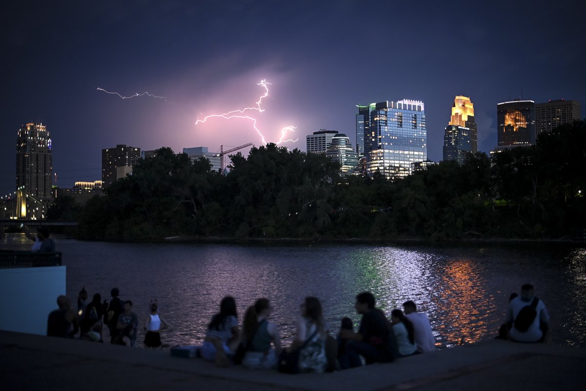 Lightning strikes beyond downtown #Minneapolis as people gather for the laser light show at Boom Island Park. @startribune #mnwx