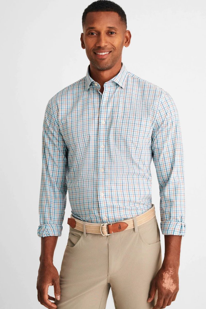 No more waiting for the dry cleaners with our easy-care performance button ups!  Lightweight, moisture wicking, and UPF 50 with a crisp, cool feel and our signature Tweener Button, these versatile button ups are ideal for the guy on the go. Shallow tail, so may be worn untucked.