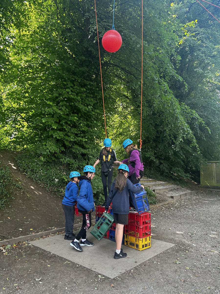 Working as a team to build a tower tall enough to reach the red ball. Well done everyone! 👏 👏